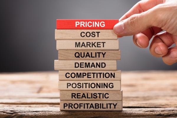 wooden blocks with the elements of pricing strategy